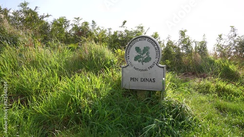 Pen Dinas Sign in Grassland of Dinas Island, Wales UK photo