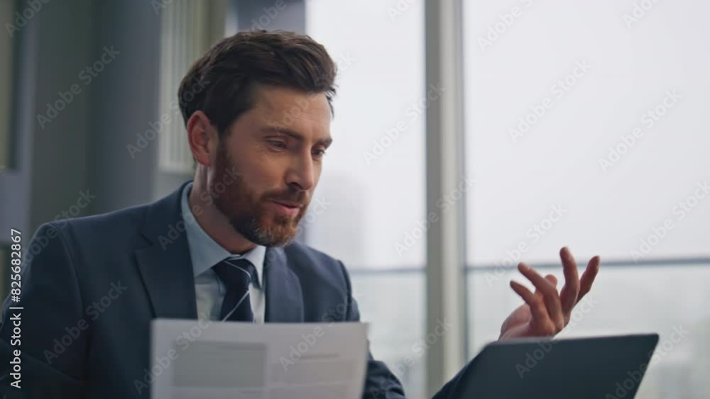 Confident man talking online computer at desk closeup. Lawyer holding contract Confident man talking online computer at desk closeup. Lawyer holding contract