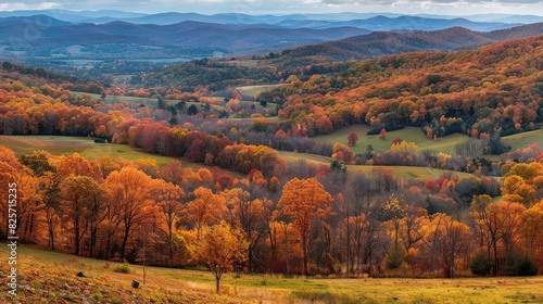 A scenic vista of rolling hills blanketed in autumn foliage, stretching as far as the eye can see in the leafy season.
