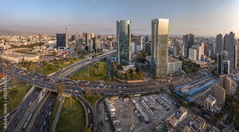Fototapeta premium Aerial view of the intersection of Javier Prado Avenue and Via Expresa in San Isidro, Lima, Peru. The image captures the bustling urban landscape, and modern skyscrapers surrounding the area.