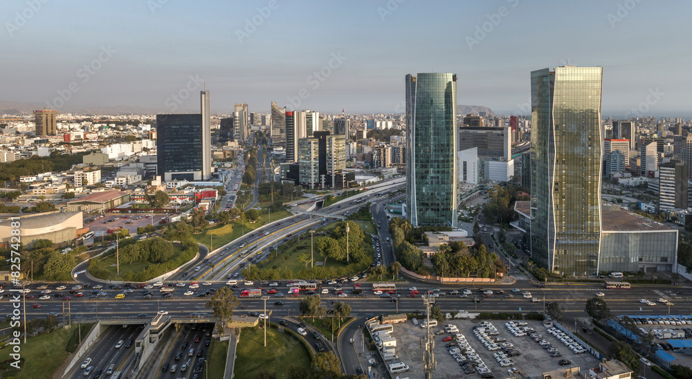 Aerial view of the intersection of Javier Prado Avenue and Via Expresa in San Isidro, Lima, Peru. The image captures the bustling urban landscape, and modern skyscrapers surrounding the area.