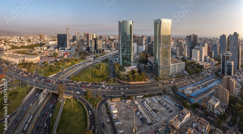 Aerial view of the intersection of Javier Prado Avenue and Via Expresa in San Isidro, Lima, Peru. The image captures the bustling urban landscape, and modern skyscrapers surrounding the area. photo