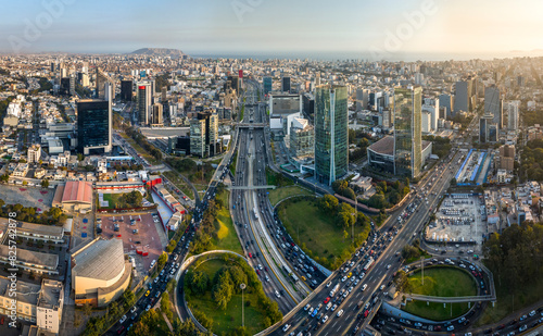 Aerial view of the intersection of Javier Prado Avenue and Via Expresa in San Isidro  Lima  Peru. The image captures the bustling urban landscape  and modern skyscrapers surrounding the area.