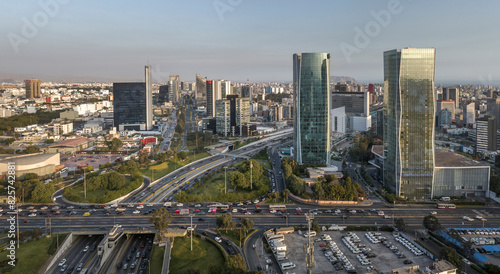 Aerial view of the intersection of Javier Prado Avenue and Via Expresa in San Isidro, Lima, Peru. The image captures the bustling urban landscape, and modern skyscrapers surrounding the area. photo