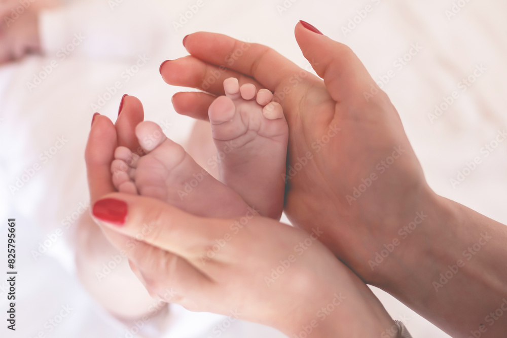 Parent holding in the hands feet of newborn baby. Parent holding in the hands feet of newborn baby.