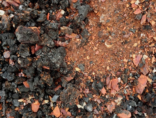 The background of waste from the burning of coal is brown. Texture of brown ash from burning coal. Industrial backgrounds and textures. photo