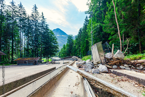 destructed of bobsledding Schönau am Königssee. Berchtesgadener Land, Alps, Germany. scree and debris. Destruction by Rain and storm. since 2021: out of service.  