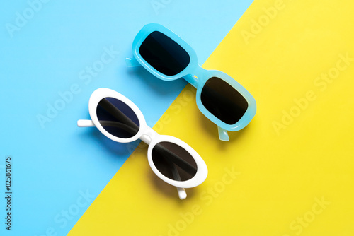 Top view of white sunglasses and blue sunglasses