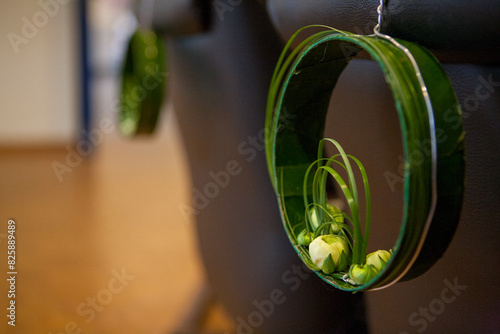A modern and elegant hanging floral arrangement with fresh green plants that showcases a contemporary aesthetic