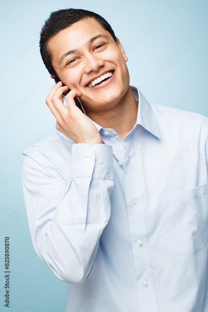 Phone call, smile and portrait of businessman in studio for corporate communication for b2b deal. Happy, contact and Asian lawyer with cellphone for mobile discussion isolated by blue background. Phone call, smile and portrait of businessman in studio for corporate communication for b2b deal. Happy, contact and Asian lawyer with cellphone for mobile discussion isolated by blue background.