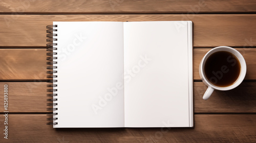 The open empty note book with cup of coffee isolated on wooden background, text space, natural light day.