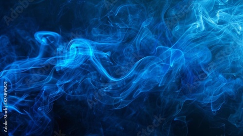 Whispy blue smoke on a dark background, perfect for themes involving mystery or the ethereal photo