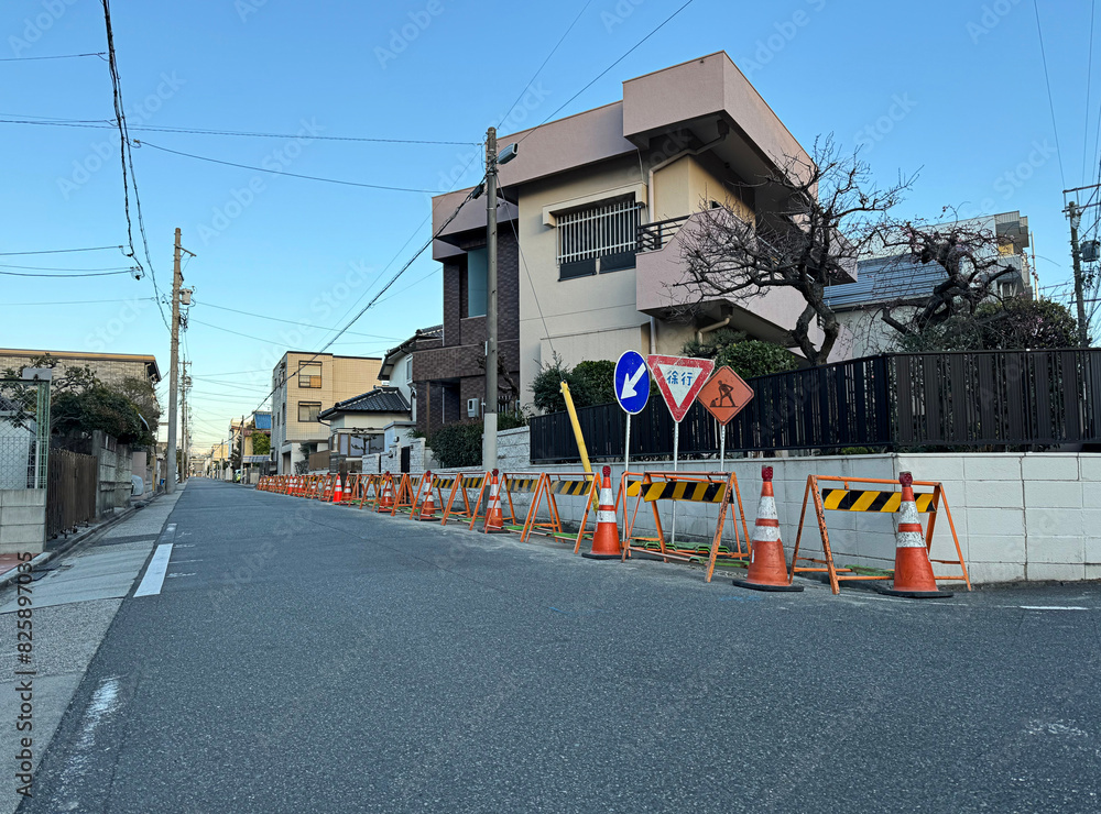 construction, traffic cones, street signs, and barricades on an old residential neighborhood street in Nagoya, Japan construction, traffic cones, street signs, and barricades on an old residential neighborhood street in Nagoya, Japan
