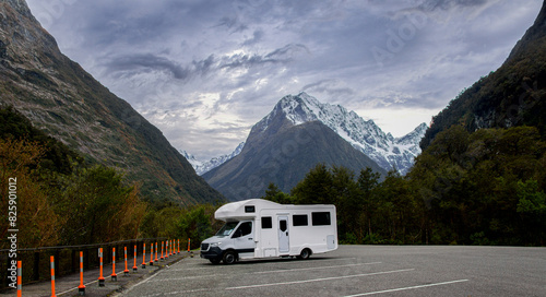 We parked our motorhome off the Milford Sound Highway to explore some waterfalls along a track. The vehicle is dwarfed by the sheer size of the surrounding snow capped mountains.