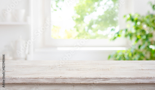 Cuadro en lienzo Empty wood table top on blur window sill and kitchen shelf background