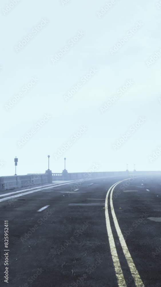 illuminated empty road bridge in a fog illuminated empty road bridge in a fog