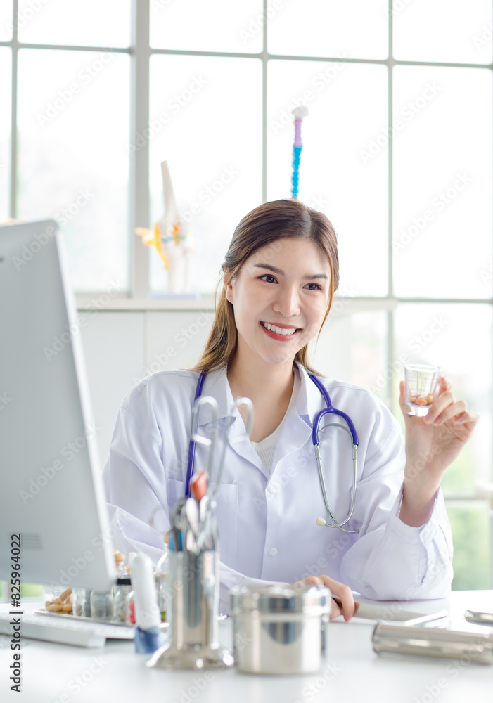 Asian woman doctor advise to use medicine in hospital examination room or clinic, treatment the disease with medicine from a specialist. Concept of medical treatment and healthcare consultation. Asian woman doctor advise to use medicine in hospital examination room or clinic, treatment the disease with medicine from a specialist. Concept of medical treatment and healthcare consultation.