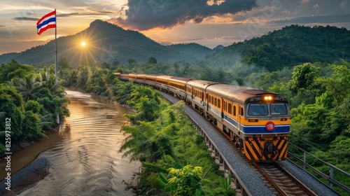 Train traveling through scenic landscape with flag and mountains during sunset. photo