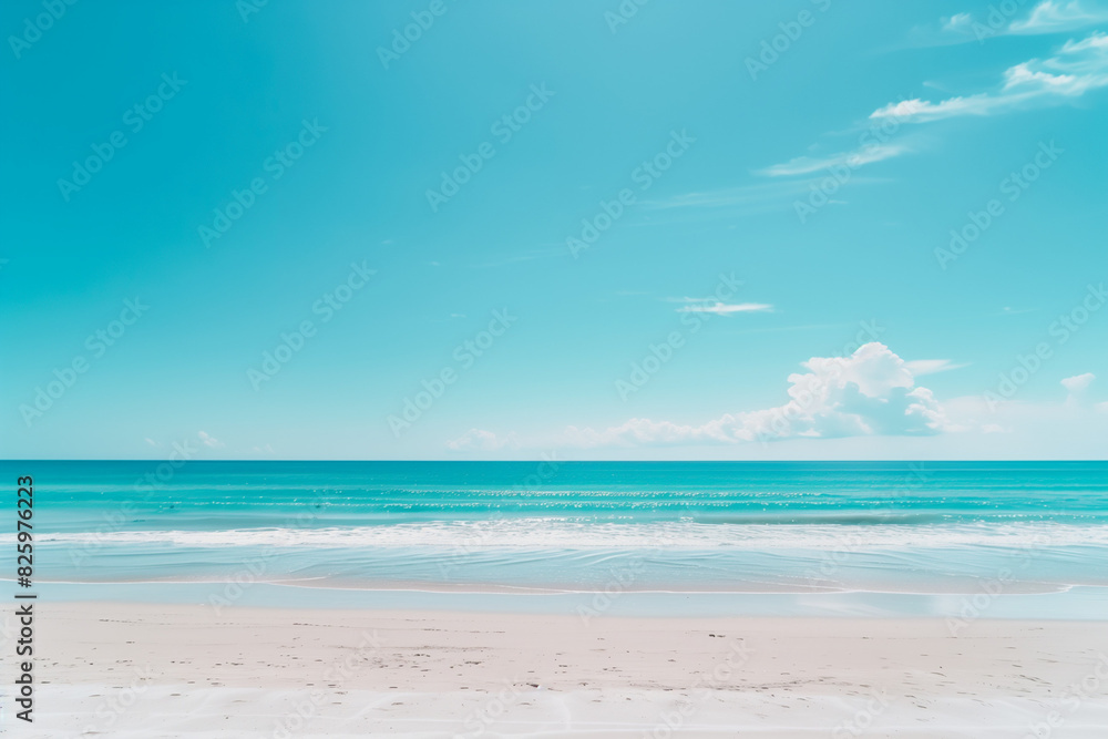 Obraz premium Sunlit Beach with Blue Sky and Ocean View