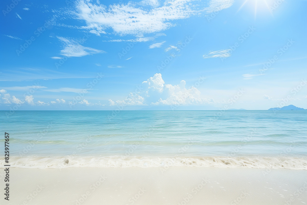Fototapeta premium Sunlit Beach with Blue Sky and Ocean View