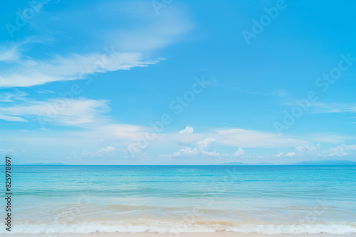 Sunlit Beach with Blue Sky and Ocean View