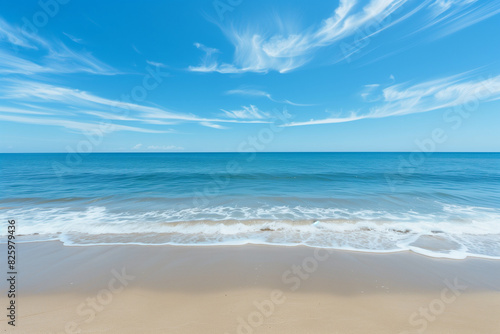 Sunlit Beach with Blue Sky and Ocean View