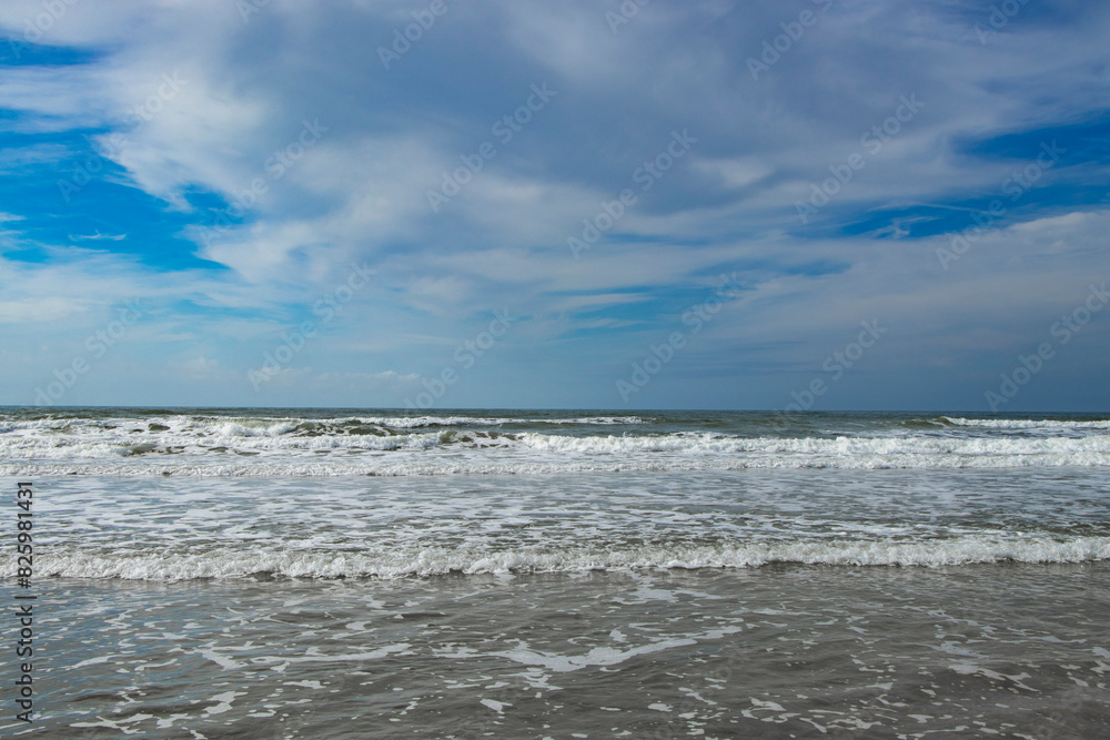 beautiful green sea at the North Sea with blue sky and clouds in Denmark Rømø beautiful green sea at the North Sea with blue sky and clouds in Denmark Rømø