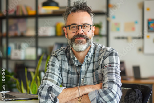 Creative professional posing confidently in modern office setting