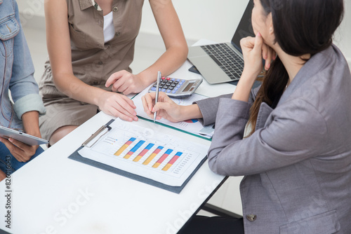 Business women talking with team in office room, Marketing secretary work on the table with manager present information to deciding