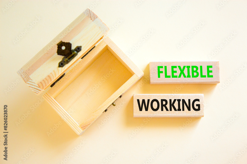 Flexible working symbol. Concept words Flexible working on beautiful wooden block. Beautiful white paper background. Empty wooden chest. Business flexible working concept. Copy space. Flexible working symbol. Concept words Flexible working on beautiful wooden block. Beautiful white paper background. Empty wooden chest. Business flexible working concept. Copy space.