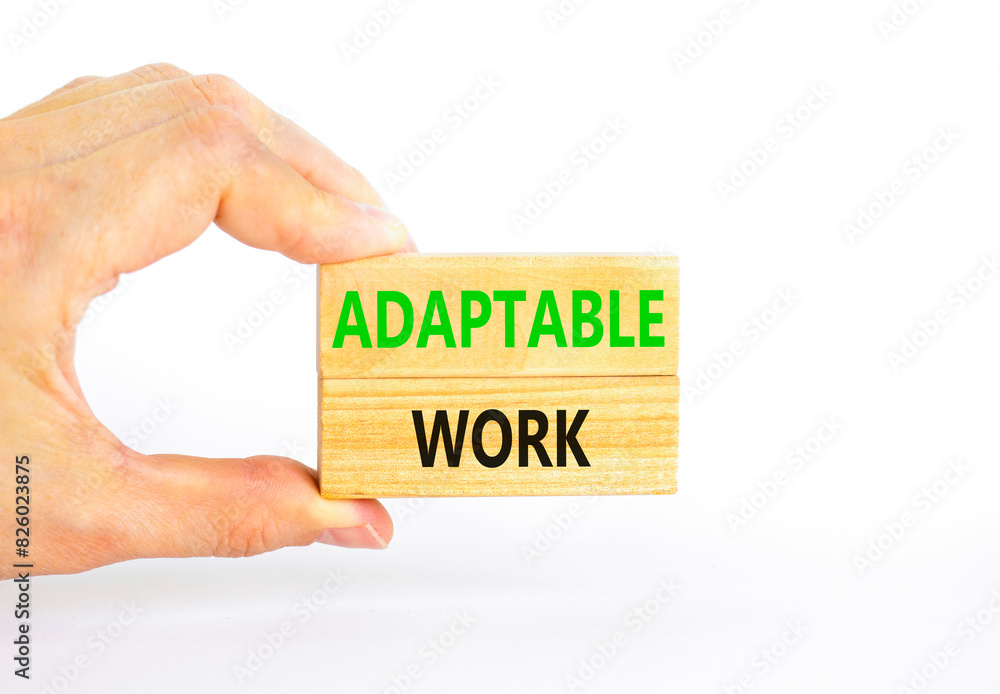 Adaptable work symbol. Concept words Adaptable work on beautiful wooden block. Beautiful white paper background. Businessman hand. Business Adaptable work concept. Copy space. Adaptable work symbol. Concept words Adaptable work on beautiful wooden block. Beautiful white paper background. Businessman hand. Business Adaptable work concept. Copy space.