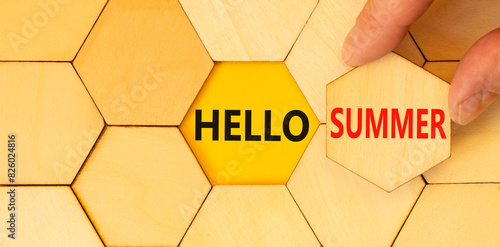 Hello summer symbol. Concept words Hello summer on beautiful wooden puzzles. Beautiful yellow background. Businessman hand. Business lifestyle Hello summer concept. Copy space.