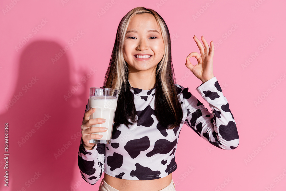 Photo of shiny attractive lady dressed cowskin clothes enjoying milk showing okey gesture isolated pink color background Photo of shiny attractive lady dressed cowskin clothes enjoying milk showing okey gesture isolated pink color background