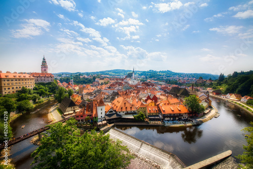 Panoramic View of Beautiful Cesky Krumlov in the Czech Republic, with the Vltava River and the Castle and the Saint Vitus Church Dominating the Old City, Approaching Noon