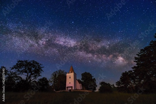 Night photo of a small old romanesque church © Ivan