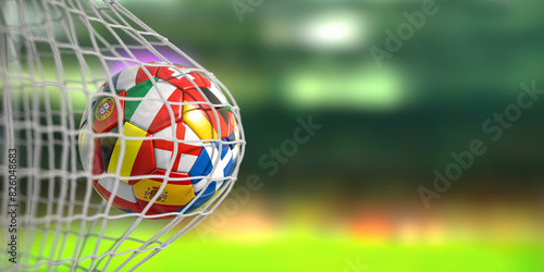 Football ball with flags of european countries in the net of goal of football stadium