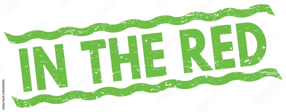 IN THE RED text on green lines stamp sign. IN THE RED text on green lines stamp sign.