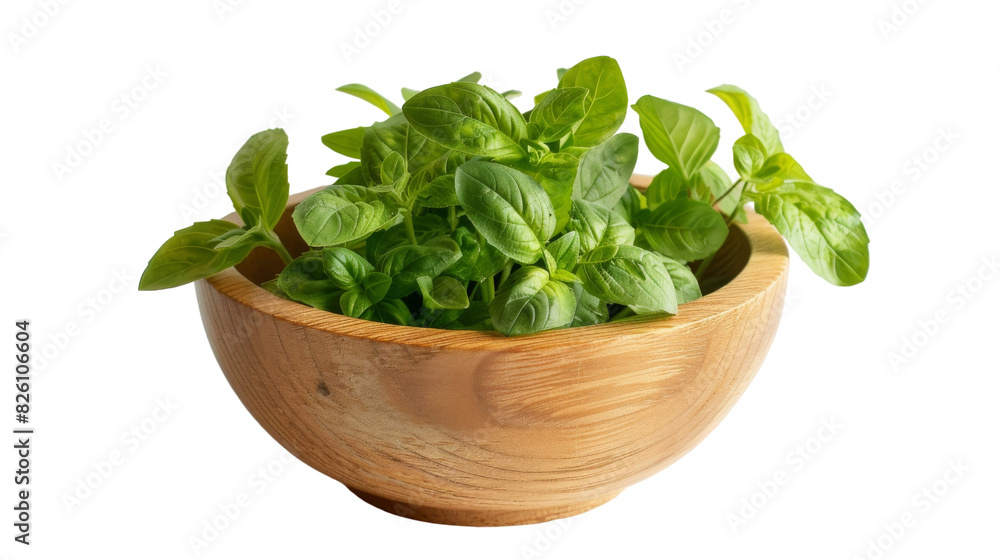 A wooden bowl is overflowing with vibrant green leaves, creating a natural and organic display A wooden bowl is overflowing with vibrant green leaves, creating a natural and organic display