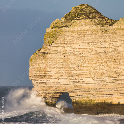 Wave at a rock in Etretat in France