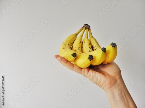 hand holding bananas