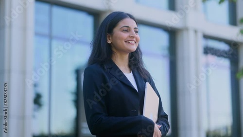 Portrait of carefree young indian woman feeling absolutely happy and satisfied enjoying great day outdoors Self confidence female looking ahead feel proud achievement alone
