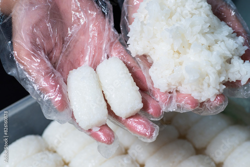 Japanese rice made with an automatic rice molding machine for making sushi.