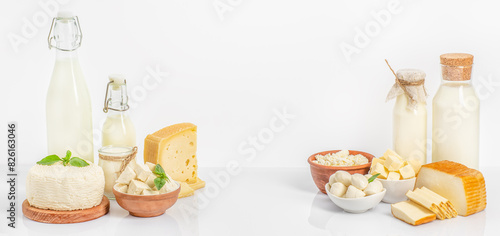 set of dairy products Bottles of milk, cheese, cottage cheese, yogurt, butter on white background. Long banner format. space for text