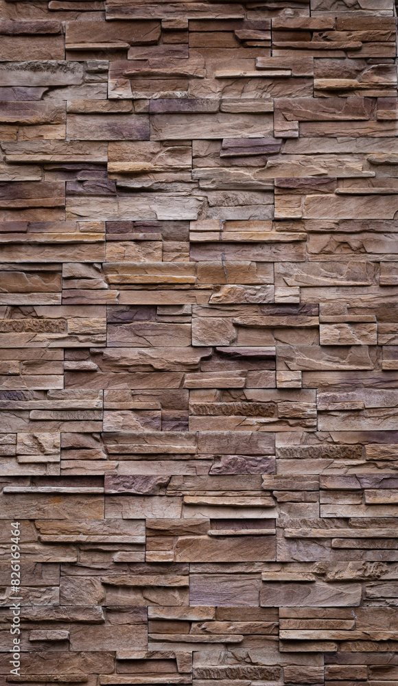 The walls are decorated with tiles made from natural red-brown sandstone. a vertical image The walls are decorated with tiles made from natural red-brown sandstone. a vertical image