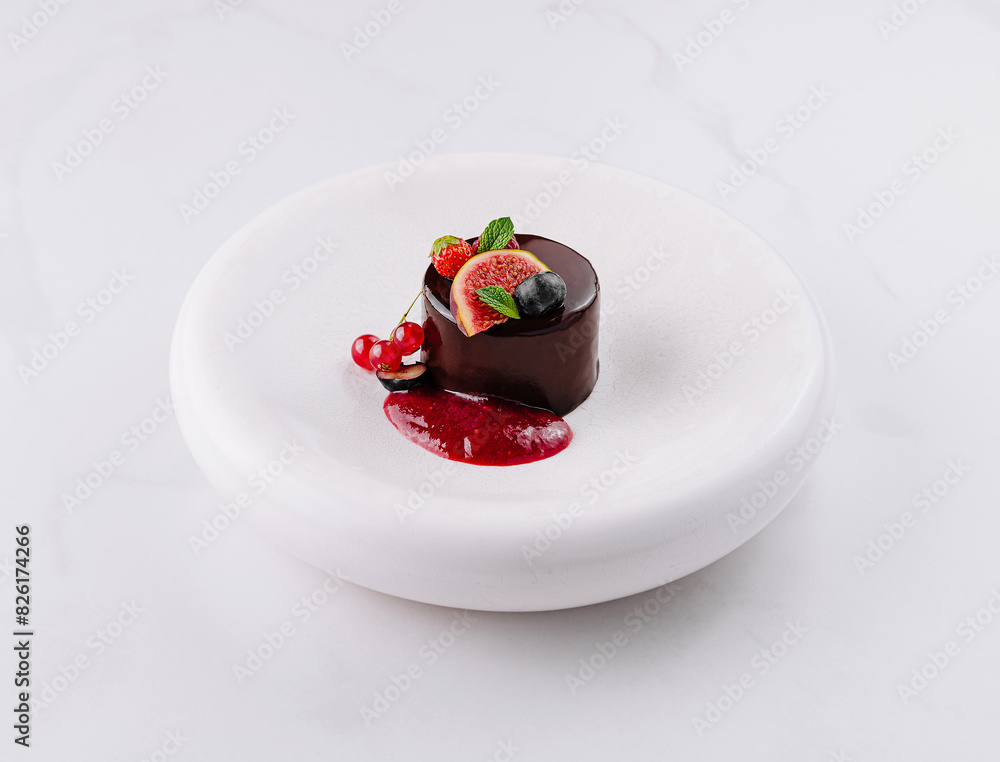 Elegant chocolate dessert with berry sauce Elegant chocolate dessert with berry sauce