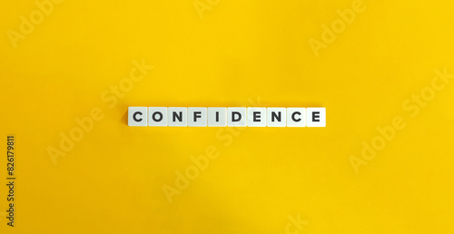 Confidence Word and Banner. Concept of developing  a sense of self-assurance and belief in one's own abilities, qualities, and judgment. Text on Block Letter Tiles on Yellow Background. photo