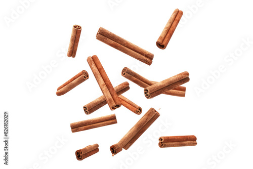 Falling cinnamon stick isolated on white background
