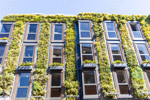 Climate change solutions using green plant walls to aid in carbon emission limitations