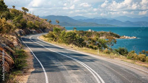 Curving road along sea in Magnetic Island Australia with mountain in the background