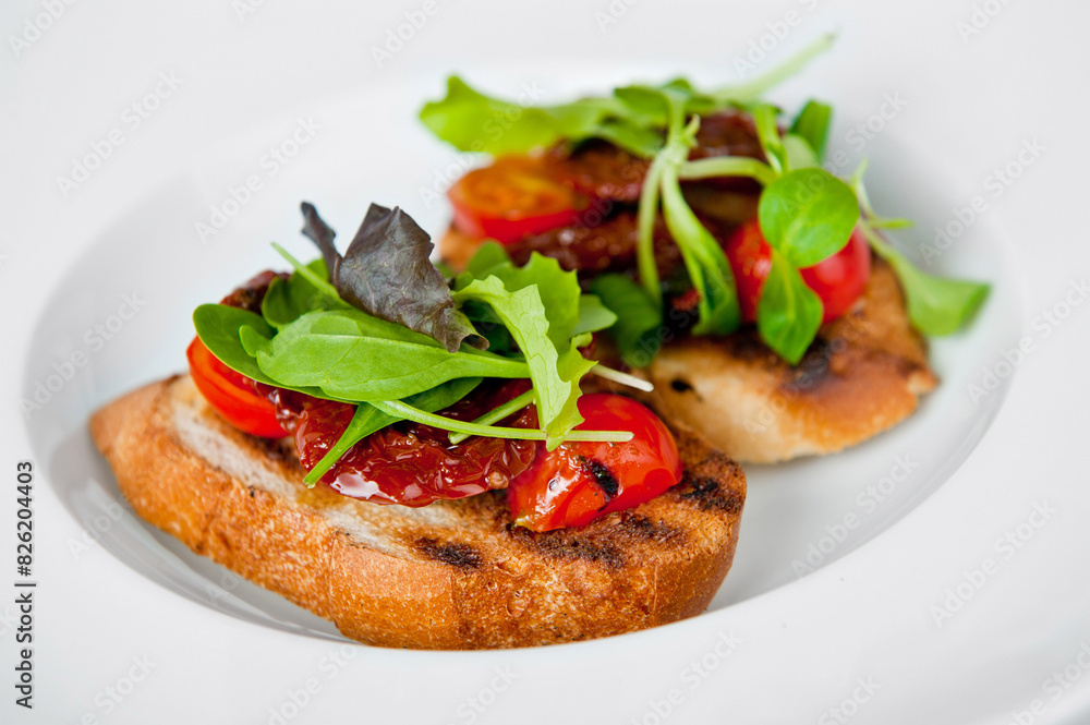 Gourmet toast with fresh tomatoes and greens